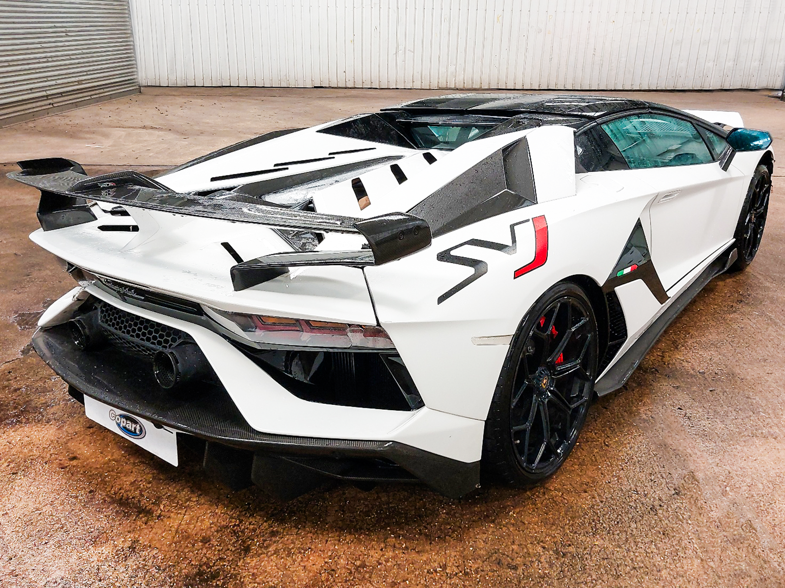 A White Lamborghini Aventador.