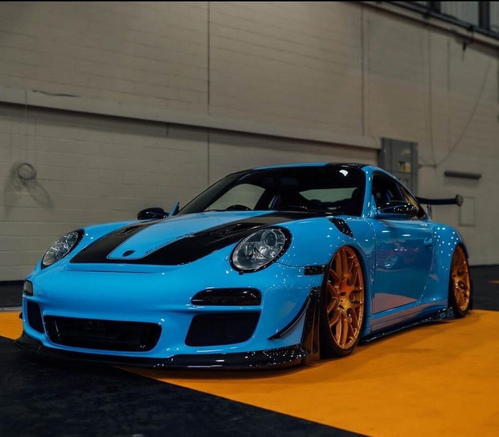 A Blue Porsche 911 close up from the front.