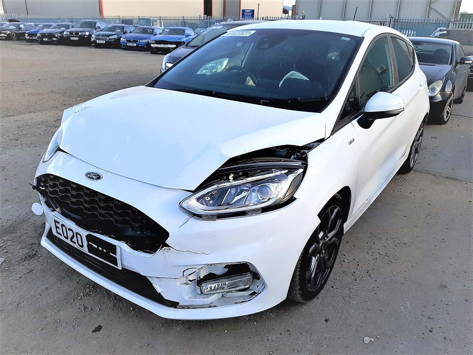 A picture of a white CAT N Ford Focus