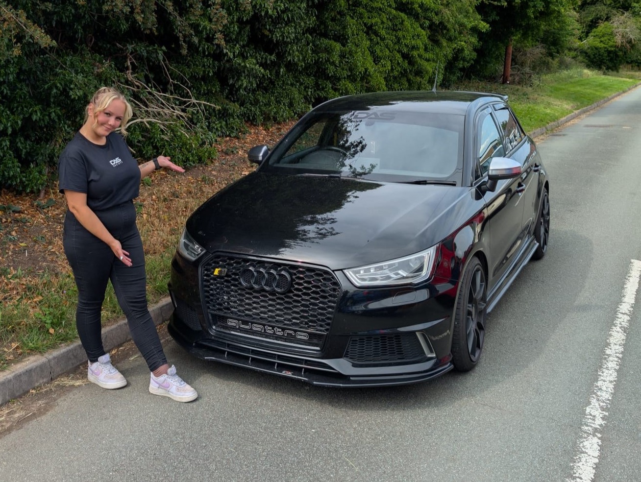 A picture of Eliza and her Audi A1.