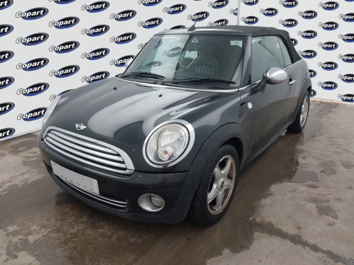 A green Mini Cooper