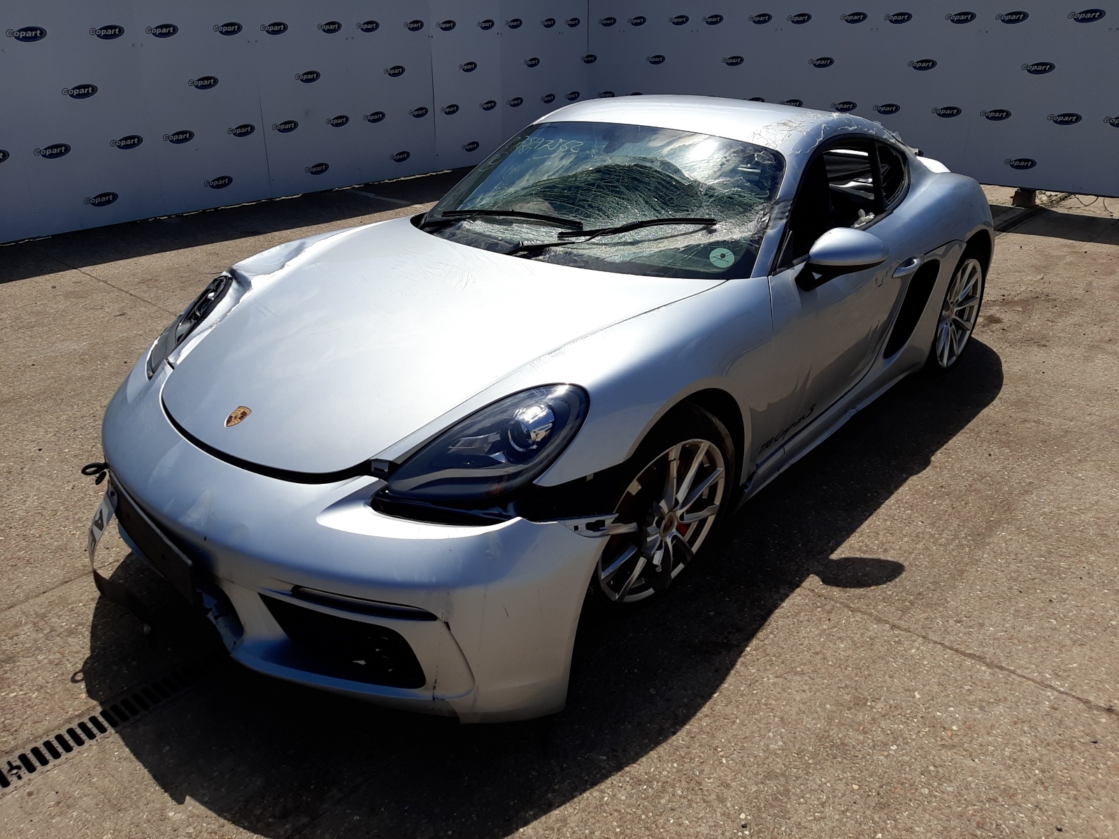 Silver damaged Porsche Cayman S
