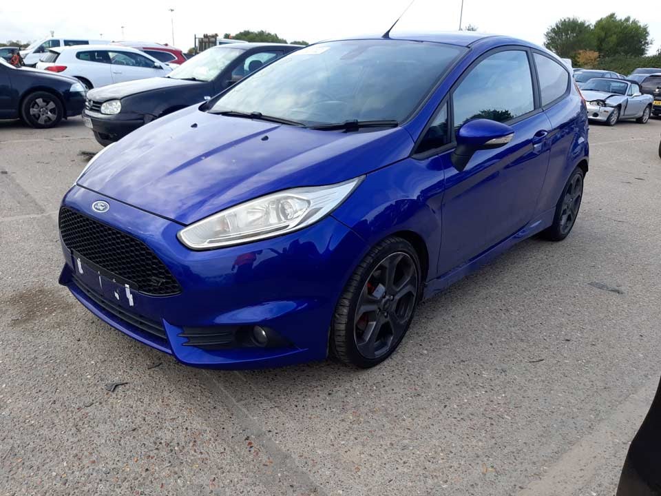 Blue Ford Fiesta parked at a Copart site