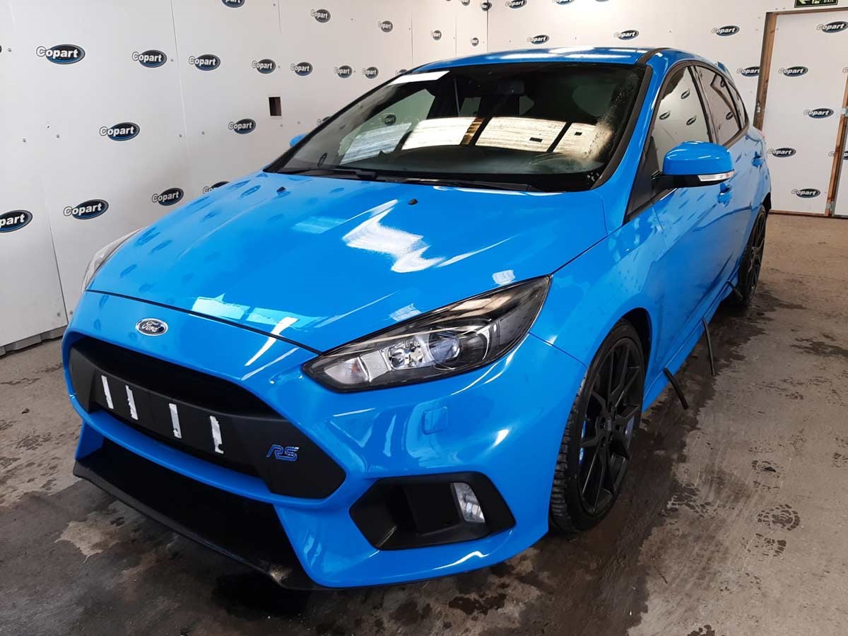 Blue Ford Focus in a Copart lot