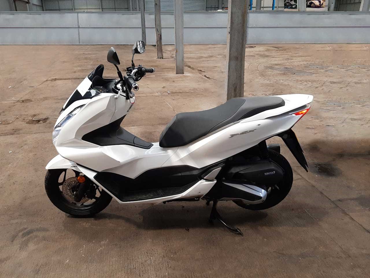 White Honda WW-125 motorbike