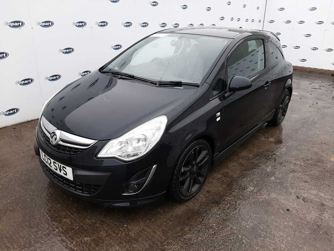 Black Vauxhall Corsa parked at a Copart site