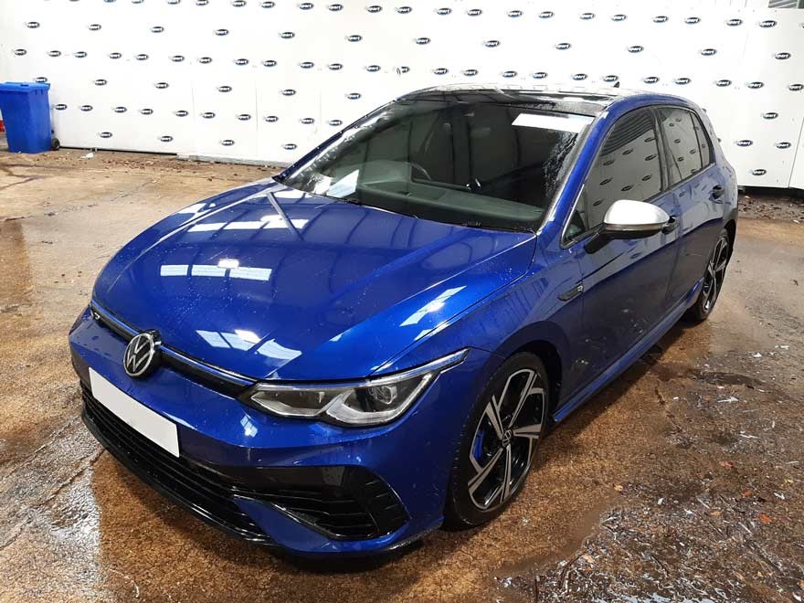 “A blue Volkswagen Golf GTI parked in a Copart lot” 