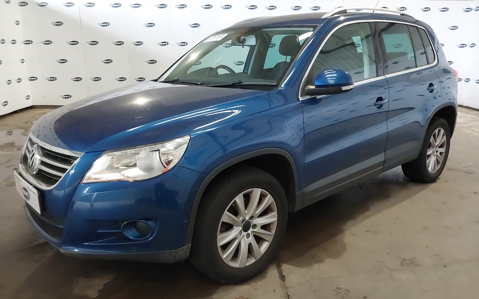 A blue Volkswagen Tiguan.