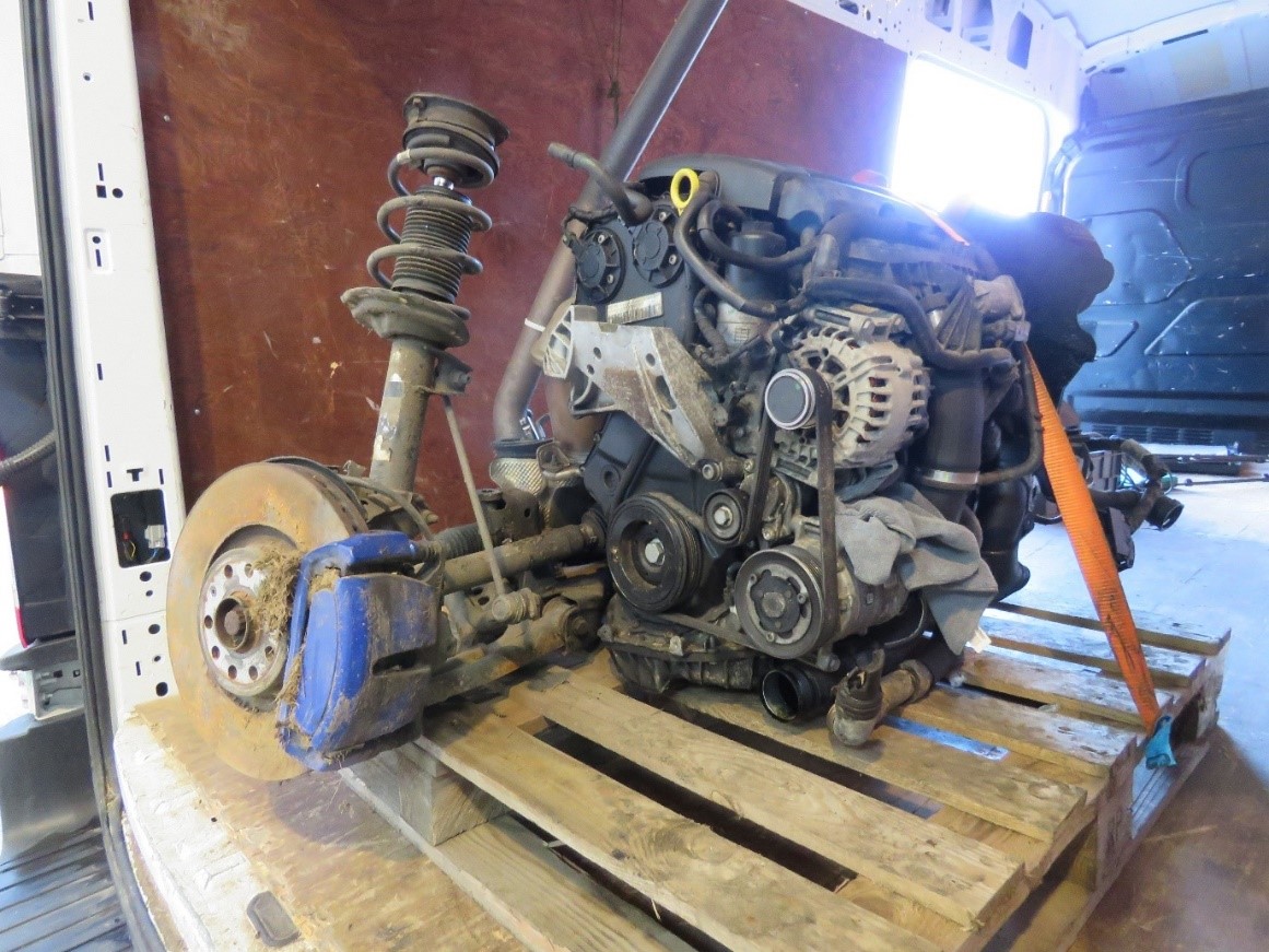 "The engine extracted from a Volkswagen Golf R tied to a palette in a van.”